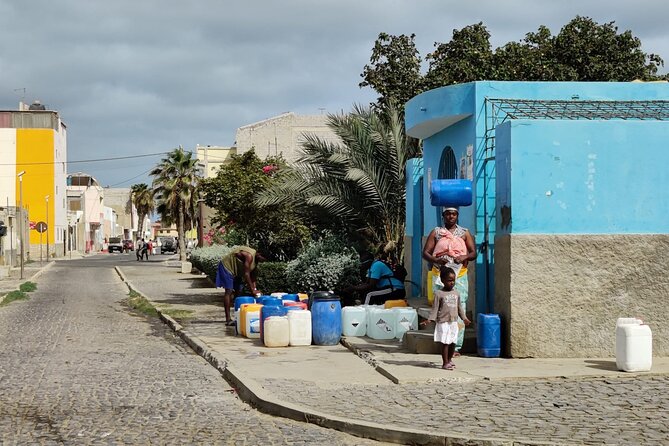 Sal island: Private Santa Maria City Tour, Street Art and Tapas - Old photographs, utensils, and the view over town