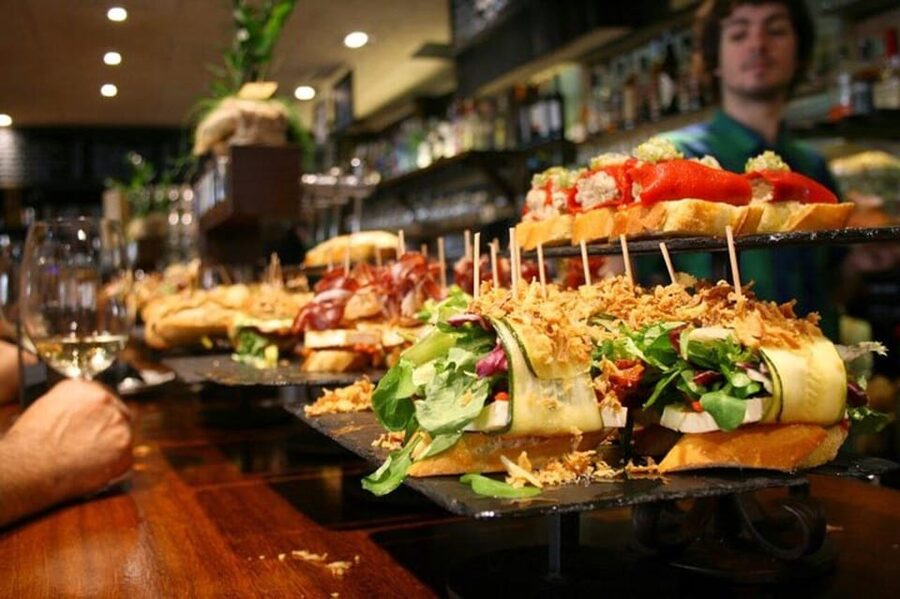 San Sebastian: Walking Tour with Pintxo and Drink - Crossing into the Old Town