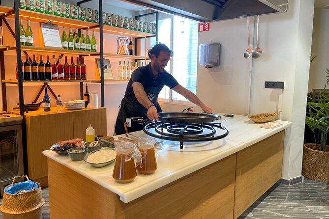 Sangria Tasting & Paella Showcooking Experience - Four sangrias, olives, and local cheese
