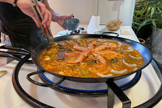 Sangria Tasting & Paella Showcooking Experience - Watching Antonio build a paella