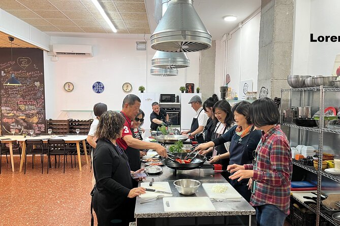 Seafood paella cooking class, tapas and visit to Ruzafa market. - Meeting at San Valero Parish