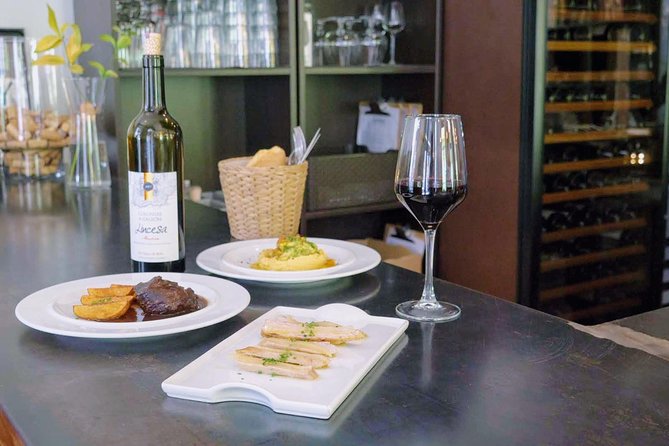 Sevilla Food Tour: Tapas, Wine, History & Traditions - Plaza del Pan and the flamenco dress tradition