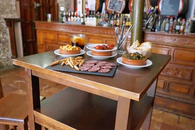 Sevilla Food Tour: Tapas, Wine, History & Traditions - Santa Cruz: meatballs, sweets, and PX