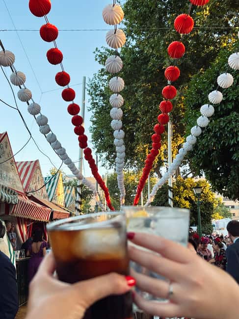 Seville: April Fair Guided Walking Tour with Tapas & Drinks - Walking through the fair with a small group