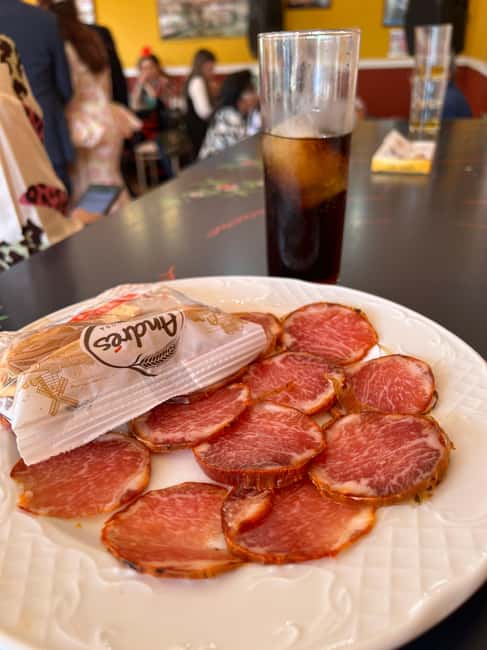 Seville: April Fair Guided Walking Tour with Tapas & Drinks - Clothing and bags at the fair