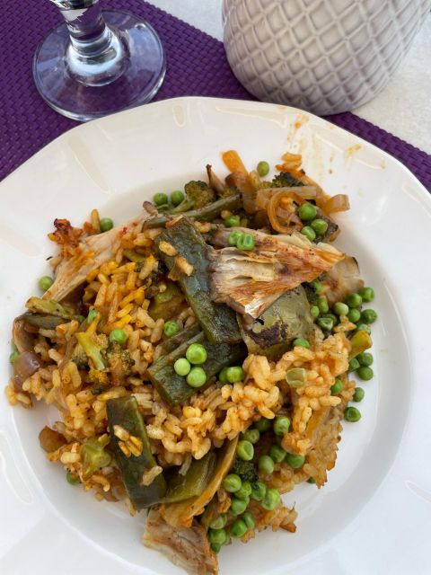 Seville: Paella and Sangria Experience - Watching a chef build traditional paella