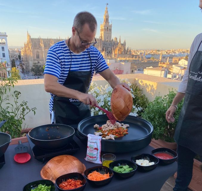 Seville: Paella Cooking Class & 30-Min Local Expert Q&A - Cooking chicken and vegetable paella