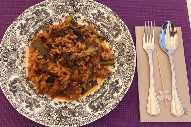 Seville: Paella Showcooking Experience - Moving from the air-conditioned room to the rooftop