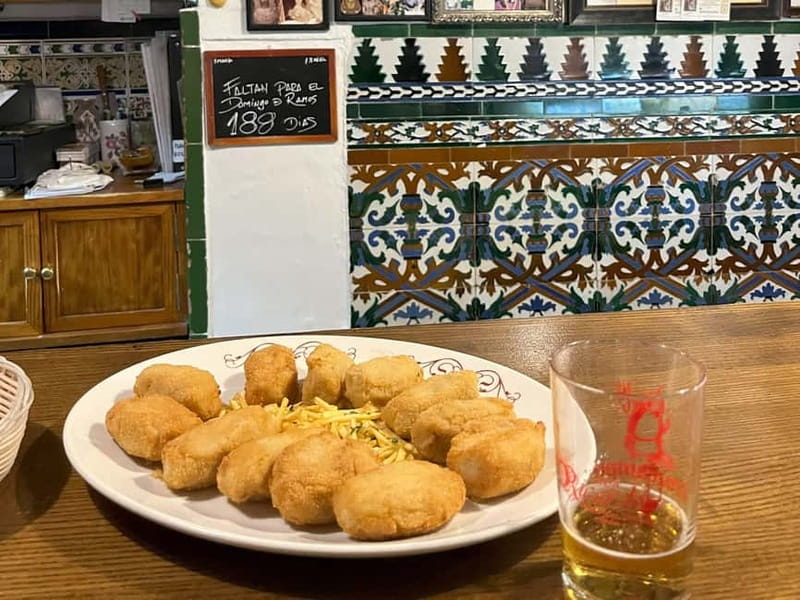 Seville: Secret Food Tour with Tapas and Drinks - A food walk built around Seville’s social life