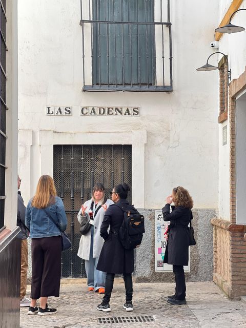 Seville: Small Group Jewish Quarter Tour with Tapas & Drinks - Calle Agua and the quarter’s darker stories