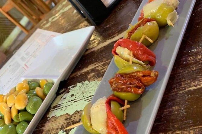 Seville Vegan Tapas Food and Market Walking Tour - Triana tapas across three or four stops
