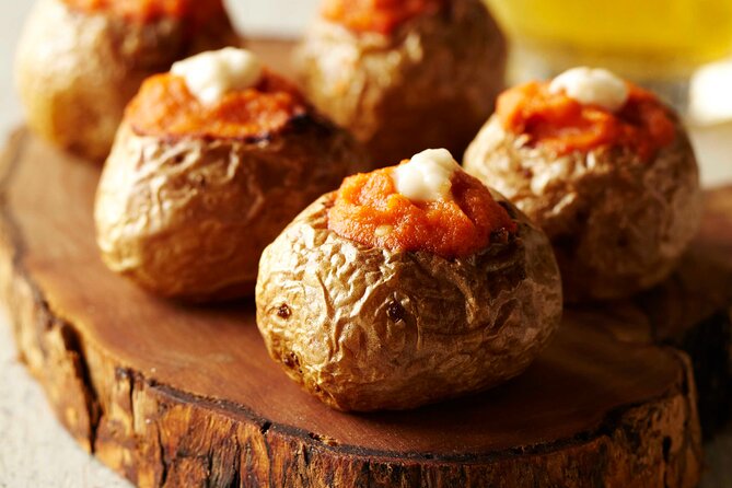 Spanish Tapas Workshop: Boqueria Tour & Rambla Views - Eating tapas with Las Ramblas views