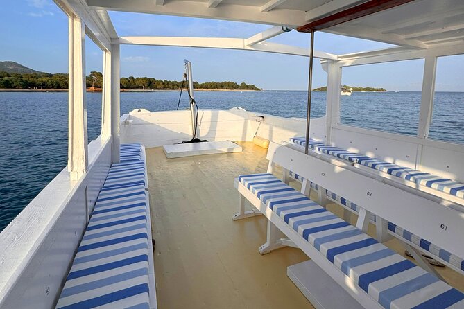 Sunset Cruise in Alcudia with Tapas & Swimming - Tapas, drinks, and the last light over the bay