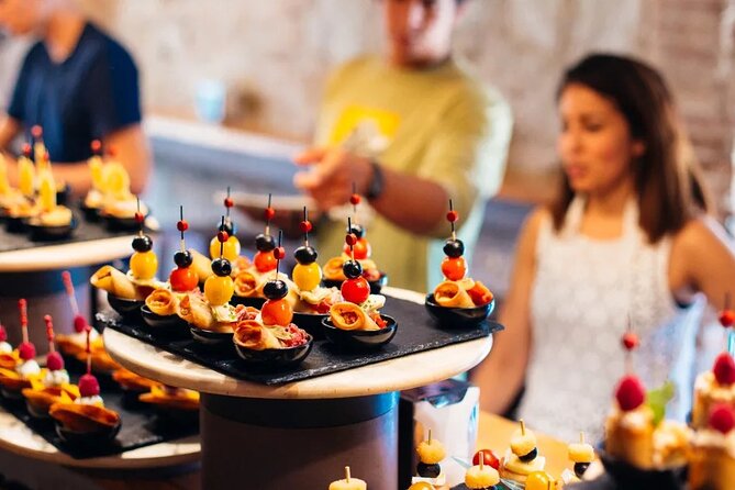 Tasty Tapas & Drinks Tour with a Rooftop Included - Three Madrid neighborhoods, four stops, one long evening