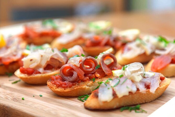 Tasty Tapas & Drinks Tour with a Rooftop Included - Patatas bravas and the first classic bar