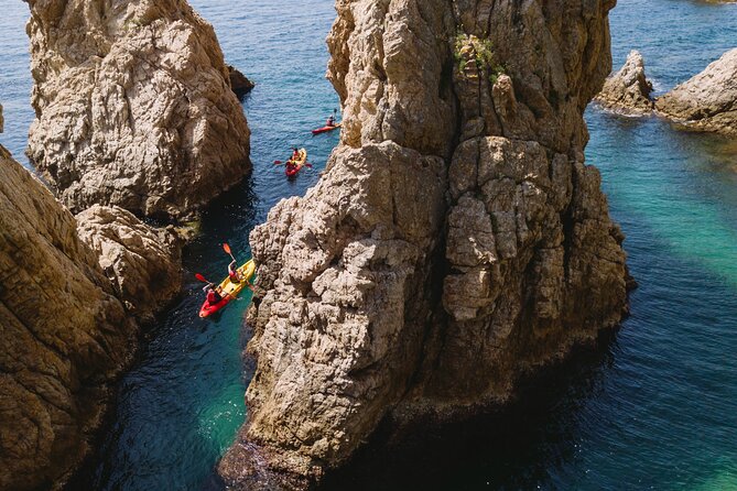 Tossa de Mar: Kayak & Snorkel Tour with Paella from Barcelona - Tossa de Mar’s medieval walls and lighthouse