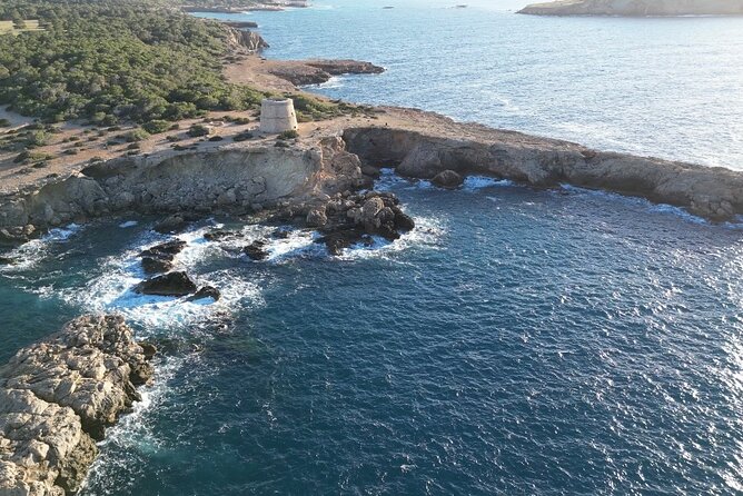 Tour in Seabob Secret Caves of Cala Bassa with Paella and Sangria - Punta de Sa Pedrera and its natural pools