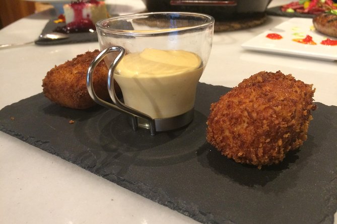 Try Madrid Best Churros, Tapas & Market by FLT - Spanish Omelette and Iberico Ham at the Market