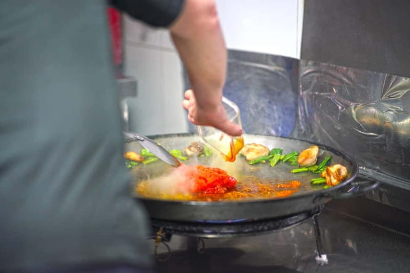 Valencia: Traditional Paella Cooking Class and Dinner - Sitting down to eat what you prepared
